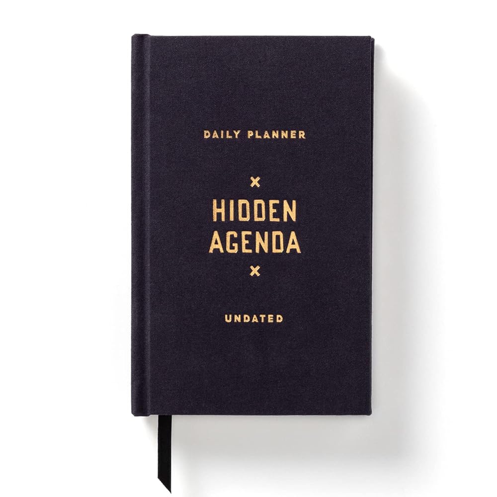Brass Monkey Hidden Agenda Mini Undated Planner, 4.75” x 7.5” – Daily Planner with 366 Days (208 Pages) – Random Holidays and Fun Added In – Mini Planner with Bookmark Included cover image